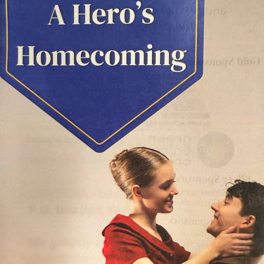 Poster for Wisconsin Dance Theatre's 'A Hero's Homecoming' with a couple embracing.